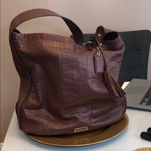 Brown tortoise coach purse